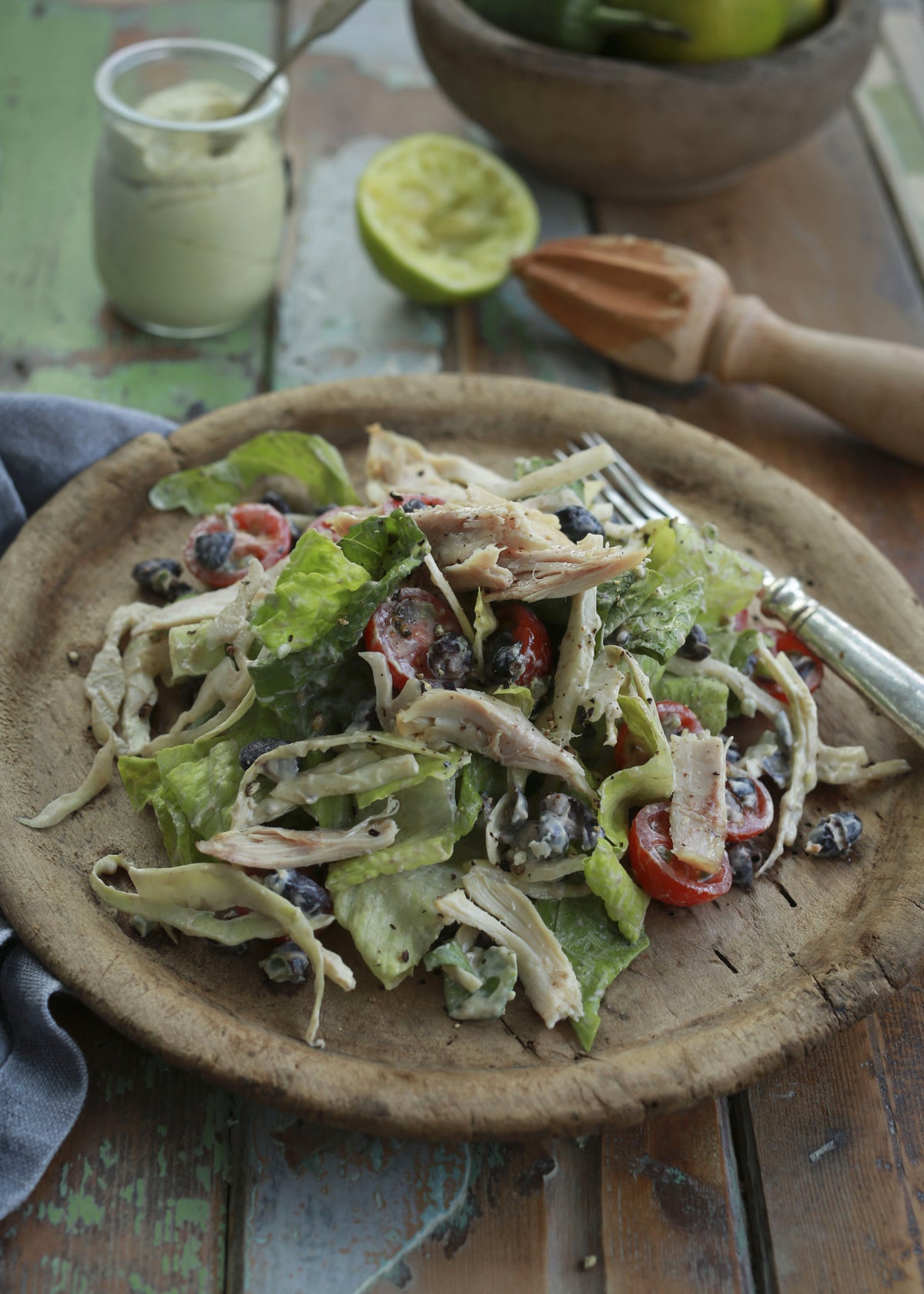 Tex-Mex chicken salad with black beans, tomatoes, lettuce and lime